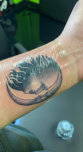 Explore fine line spine tattoo ideas, creative tattoo ideas in Oswego, available at The Inkery Tattoo Studio