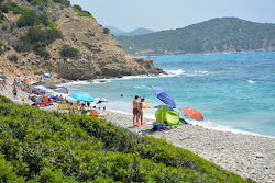 Foto von Is Canaleddus Beach und die siedlung