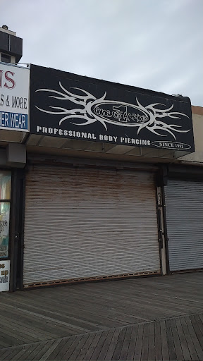 Explore boxer tattoo ideas, creative tattoo ideas in Atlantic City, available at ONE OF A KIND - Body Piercing