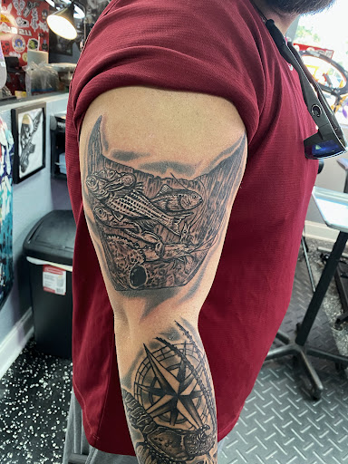 Explore blackout hand tattoo ideas, creative tattoo ideas in Fort Myers, available at Loyal 2 The Coil Tattoos & Piercings (Edison Mall Location Entrance F)