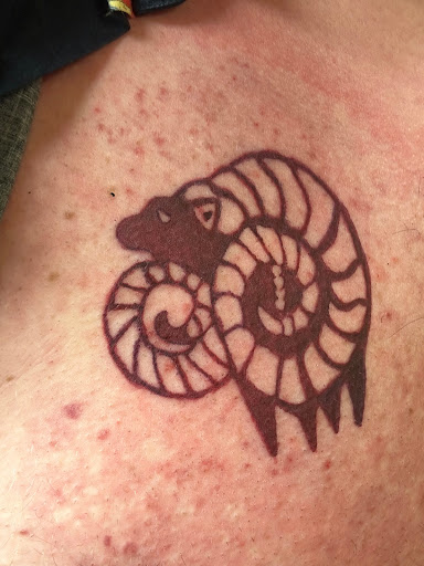 Explore healing symbol tattoo ideas, creative tattoo ideas in Sioux City, available at Asawolf Viking Tattoo