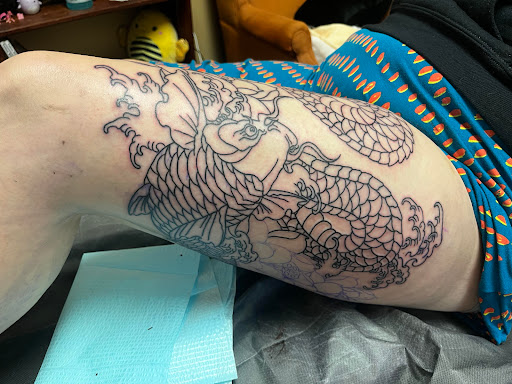 Explore belle tattoo ideas, creative tattoo ideas in Winterville, available at Garrys Skin Grafix Tattoo Studio