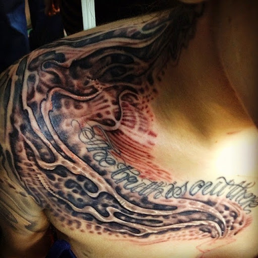 Explore female full back tattoo ideas, creative tattoo ideas in Huntsville, available at Blacktide Tattoo Co.