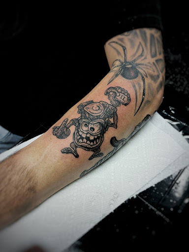 Explore leg tattoo idea for men, creative tattoo ideas in North Fort Myers, available at Loyal 2 The Coil Tattoos & Body Piercings