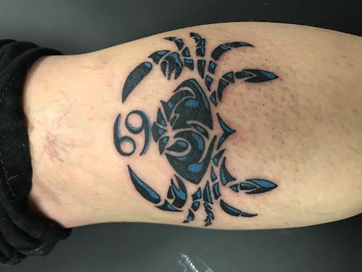 Explore guy thigh tattoo ideas, creative tattoo ideas in Muncie, available at The Tattoo Studio