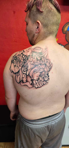 Explore dominican flag tattoo ideas, creative tattoo ideas in Fort Wayne, available at drieM World Tattoos & Art Gallery