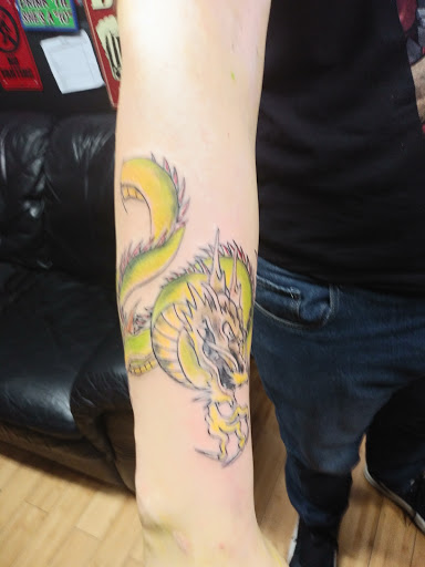 Explore throat tattoo ideas for females, creative tattoo ideas in Newark, available at Bad Intentionz Tattoo & Piercings Studio