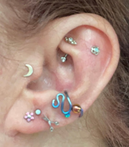 Explore book lovers tattoo ideas, creative tattoo ideas in Medford, available at Agave in Bloom Piercing & Fine Jewelry