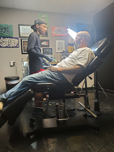 Explore long thin tattoo ideas, creative tattoo ideas in Greer, available at Inkslingers Electric Tattooing