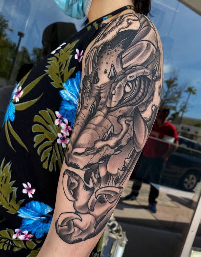 Explore handcuff tattoo ideas, creative tattoo ideas in Hollywood, available at Sacred Eye Tattoos