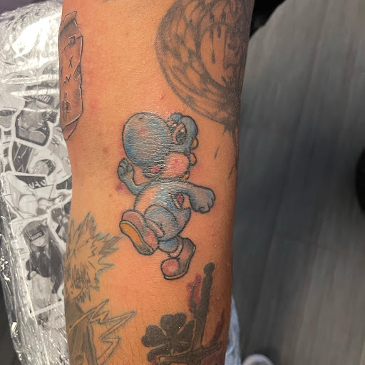 Explore fist tattoo ideas, creative tattoo ideas in Palm Harbor, available at Angry Owl Tattoo and Piercing