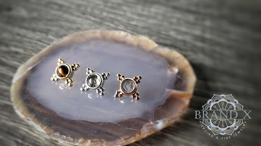 Explore tattoo ideas sword, creative tattoo ideas in Longview, available at Brand X Piercing & Fine Jewelry