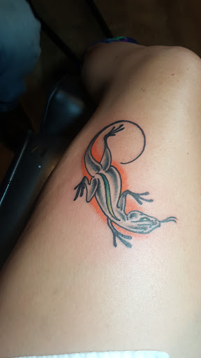 Find women's rib tattoo ideas for your next unique tattoo in Asheville at Pure Steam Tattoo