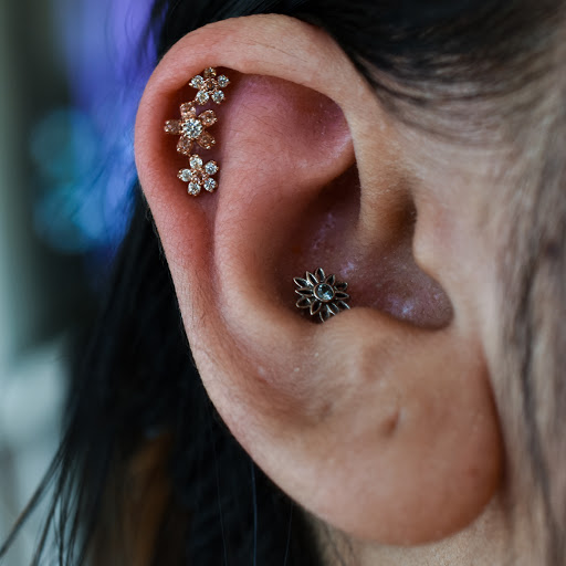 Explore smiley face tattoo ideas, creative tattoo ideas in Reno, available at Black Hole Body Piercing