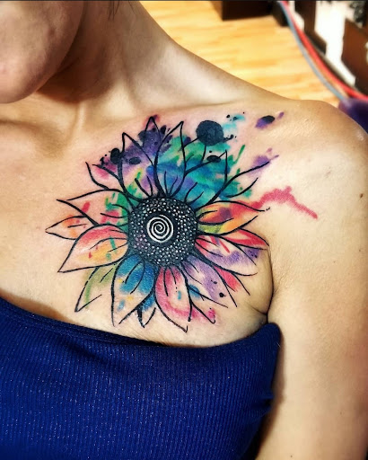 Explore flower back tattoo ideas, creative tattoo ideas in Benton, available at Spectrum Tattoo