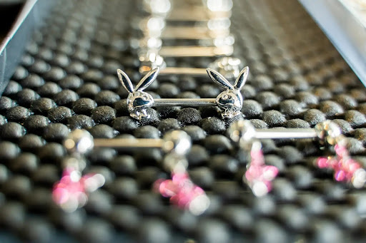 Explore tattoo sleeve skull ideas, creative tattoo ideas in Summerville, available at Exotic Impressions Body Piercing