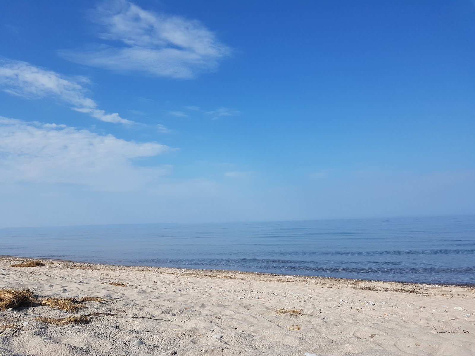 Fotografija Bluewater Beach z turkizna čista voda površino