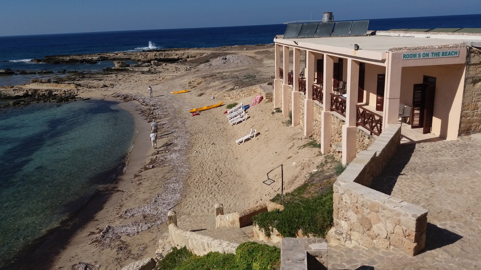 Oasis Beach'in fotoğrafı düz bir kıyı şeridi ile birlikte