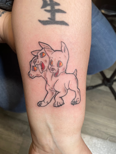 Explore red bird tattoo ideas, creative tattoo ideas in Athol, available at Ragnark Tattoo Company