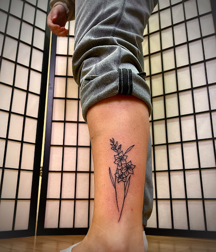 Explore tattoo cover up ideas for words, creative tattoo ideas in Cedar Falls, available at Omega Red Piercing & Tattoo