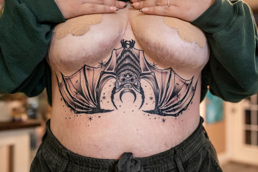 Explore tramp stamp tattoos ideas, creative tattoo ideas in Leesville, available at Revolution Ink Tattoo and Art Gallery