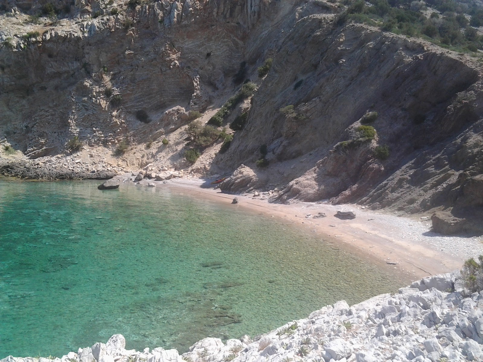 Foto av Minas scr. beach III med beige småsten yta