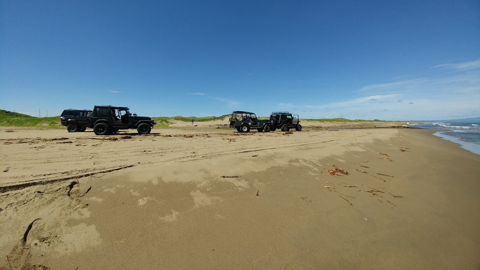Foto van Playa El Tesoro met beige zand oppervlakte