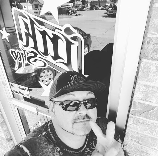 Explore cool hand tattoo ideas for guys, creative tattoo ideas in Kearney, available at Ink Shop Tattoos & Piercings