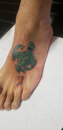 Explore daughter tattoo ideas for dads, creative tattoo ideas in Venice, available at Ink Monkey Tattoo and Piercing