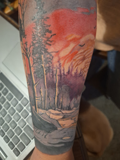 Find dragon arm tattoo ideas for your next unique tattoo in Fort Gratiot at Sarenity Tattoo & Body Piercing