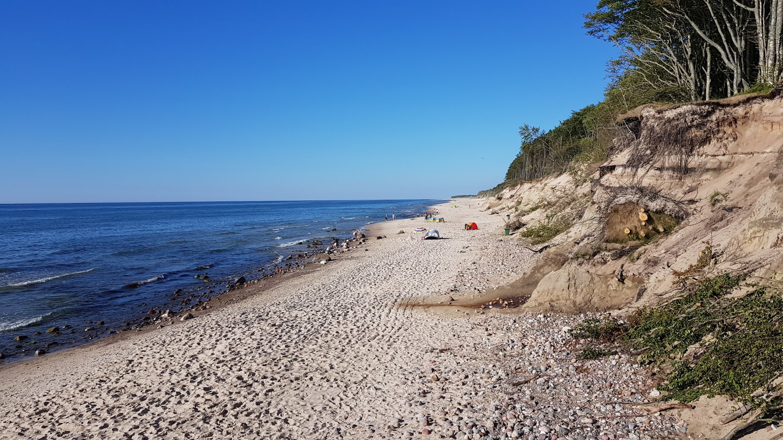 Fotografie cu Debina Beach și așezarea
