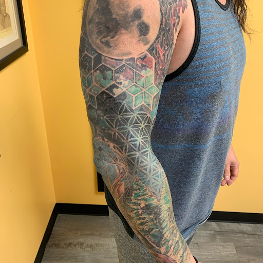 Explore flower tattoo cover up ideas, creative tattoo ideas in Marietta, available at Lure Tattooing & Piercing LLC