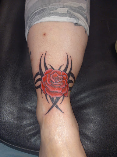 Explore cover up tattoo ideas leg, creative tattoo ideas in Kewanee, available at Splat Ink tattoos and piercings