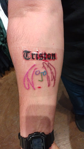 Explore spine tattoo ideas for men, creative tattoo ideas in Clovis, available at Anchors & Arrows Tattoos & Piercings