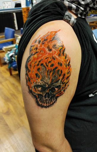 Explore david bowie tattoo ideas, creative tattoo ideas in Lafayette, available at DragonsBane Tattoo & Body Piercing