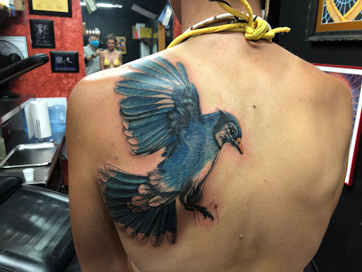 Explore middle of boob tattoo ideas, creative tattoo ideas in Sedona, available at Physical Graffiti Tattoo