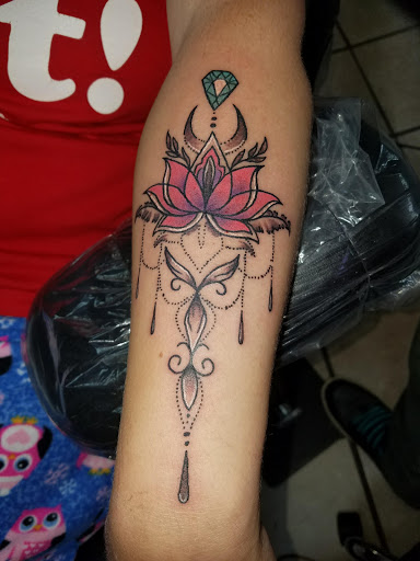 Explore spine tattoo ideas for women, creative tattoo ideas in London, available at Distinction Tattoo Studio