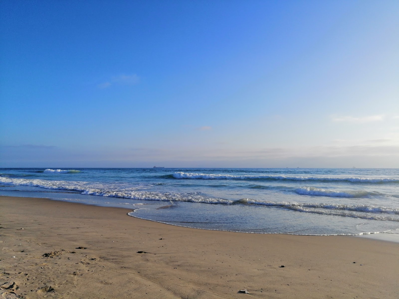 Foto av Playa Del Rosarito med lång rak strand