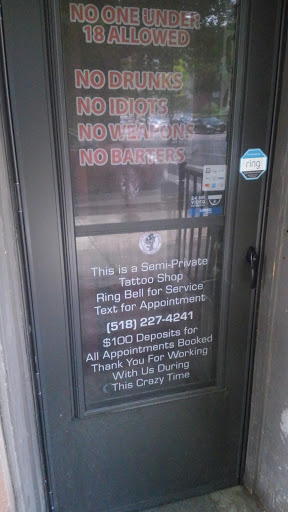 Find cool dog tattoo ideas for your next unique tattoo in Albany at The Curly Wolf Tattoo Club