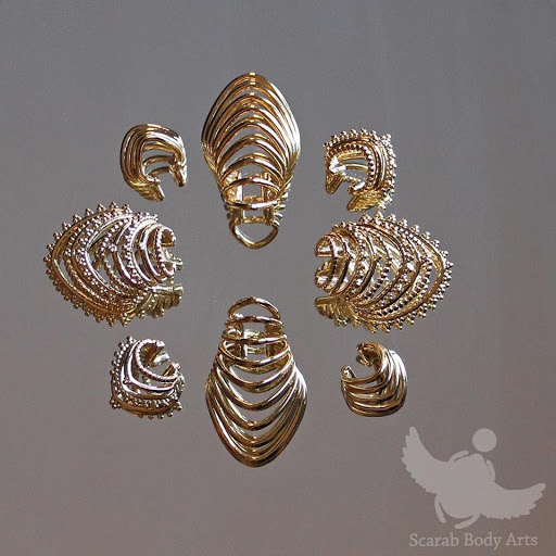 Find ideas for tattoos for grandchildren for your next unique tattoo in Syracuse at Scarab Body Arts