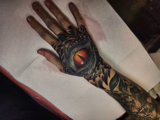 Explore dog paw tattoos ideas, creative tattoo ideas in Valdosta, available at Acid Ink Tattoos