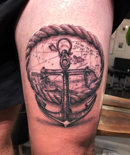 Explore thigh tattoo ideas for men, creative tattoo ideas in Dayton, available at Aisle 9 Tattoo