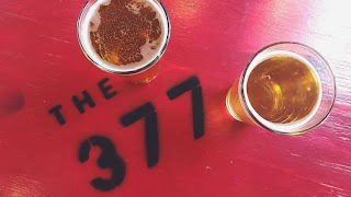 Friends sharing beers at a table