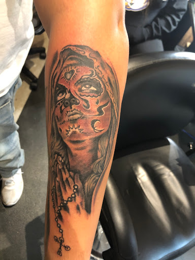 Explore traditional hand tattoo ideas, creative tattoo ideas in Cape Coral, available at UNRIVALED INK