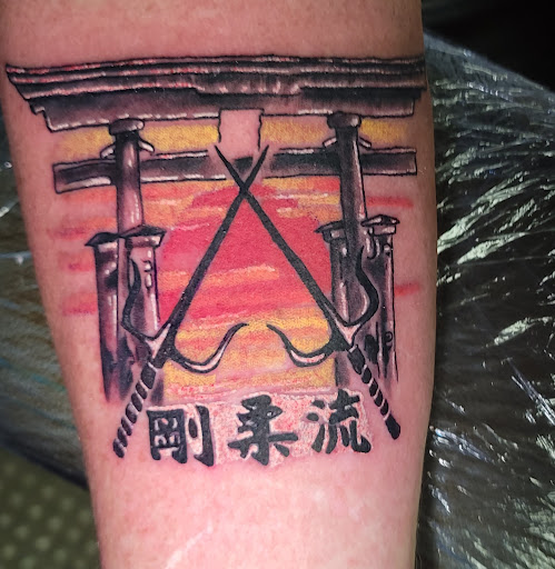 Explore invincible tattoo ideas, creative tattoo ideas in Angola, available at Hoodlum Ink