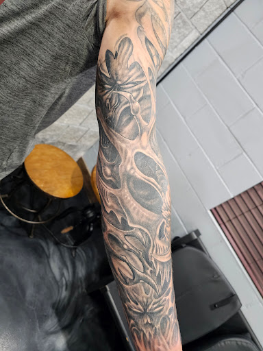 Explore bass fishing tattoo ideas, creative tattoo ideas in Medford, available at Michael Angelo Ink