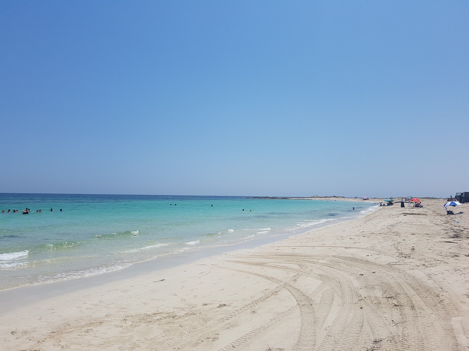 Photo of Lella Hadhria beach with turquoise pure water surface