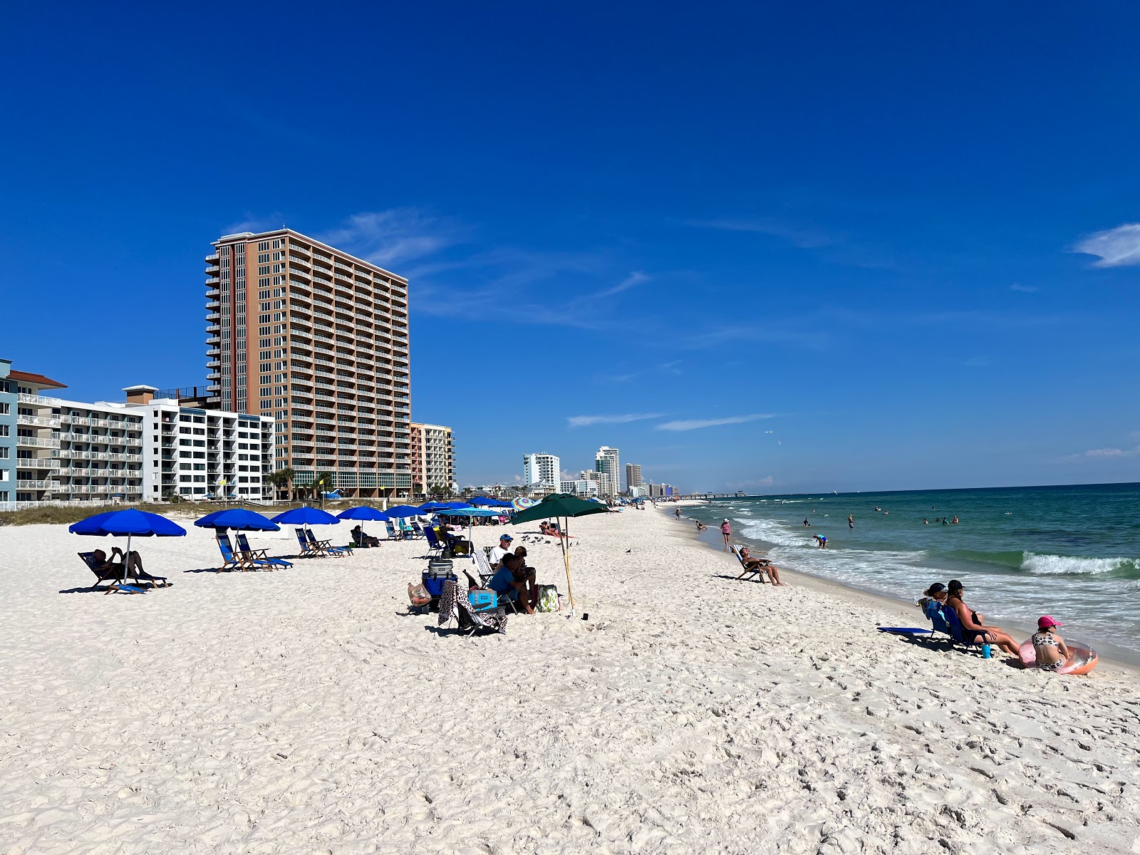 Photo of Orange Beach with blue pure water surface