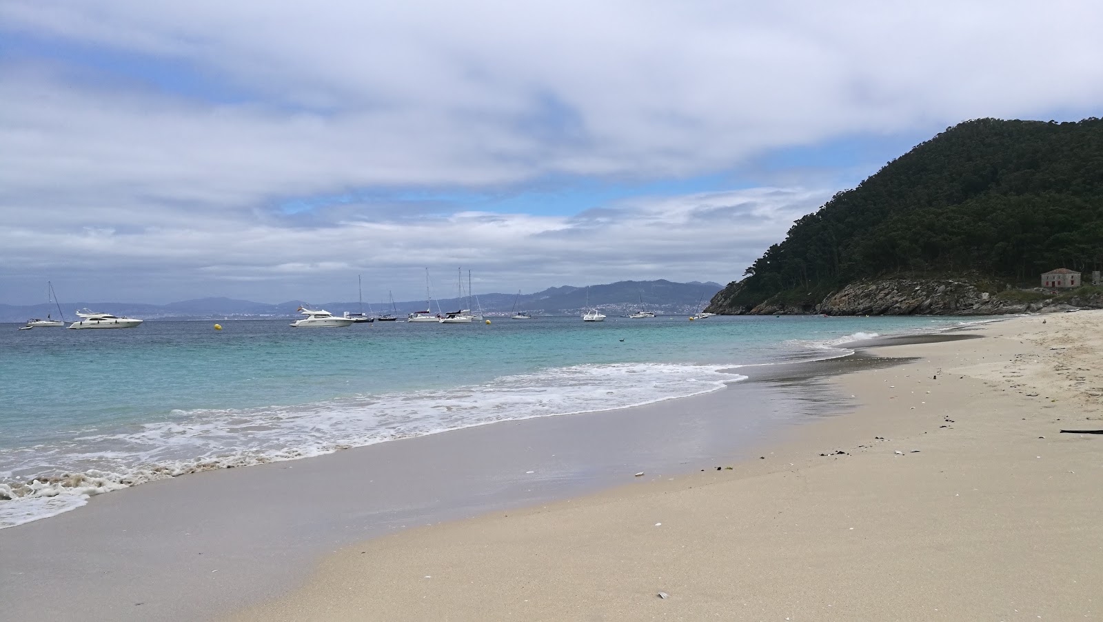 Photo of Praia de San Martino with white fine sand surface