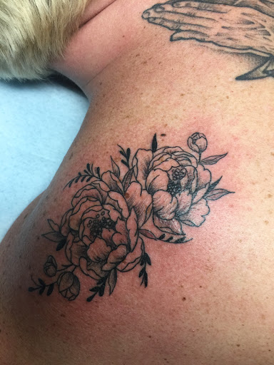 Explore hood tattoo ideas, creative tattoo ideas in Mount Juliet, available at Division Street Tattoo Company